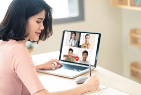 Asian business woman talking to colleague team about plan in video conference. Group of multiethnic business people using computer for online meeting in video call conference. Smart working from home.